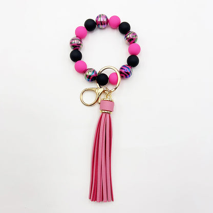 Pulsera de cuentas hecha a mano con borlas y llavero