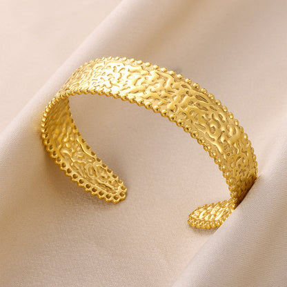 Pulsera de acero inoxidable dorado con patrón cóncavo-convexo