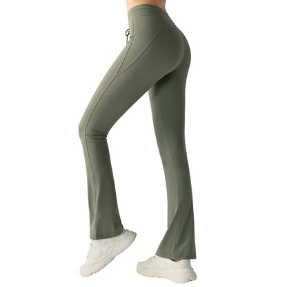 Pantalones de yoga casuales que adelgazan la cintura y levantan la cadera Pantalones de yoga con bolsillos bilaterales y cintura acampanada