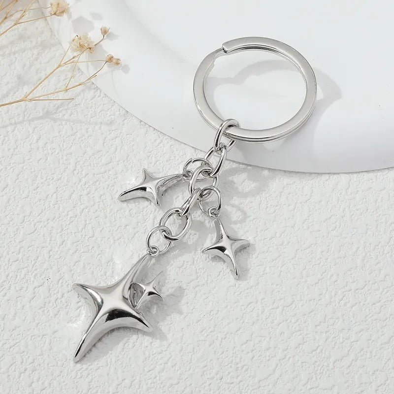 Llave de aleación con forma de estrella y luna de moda creativa