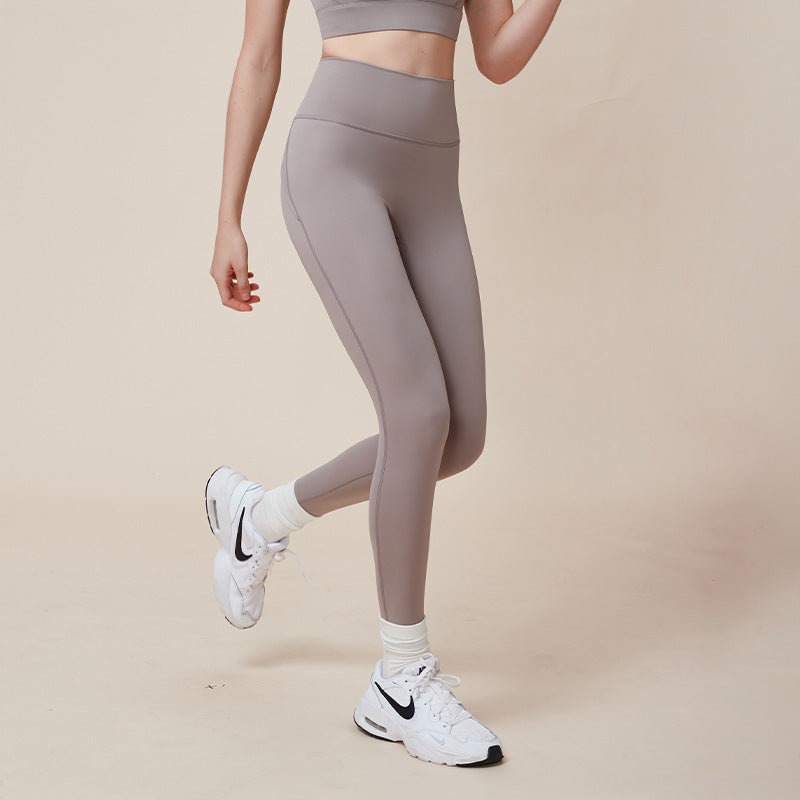 Pantalones de yoga deportivos de cintura alta color melocotón que mejoran la elevación de caderas y adelgazan la cintura