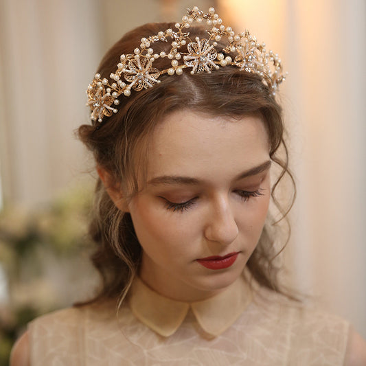 Tocado exquisito de perlas y cristales para novias