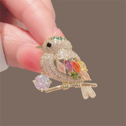 Broche de pájaro urraca con diamantes