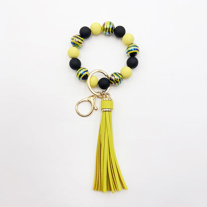 Pulsera de cuentas hecha a mano con borlas y llavero