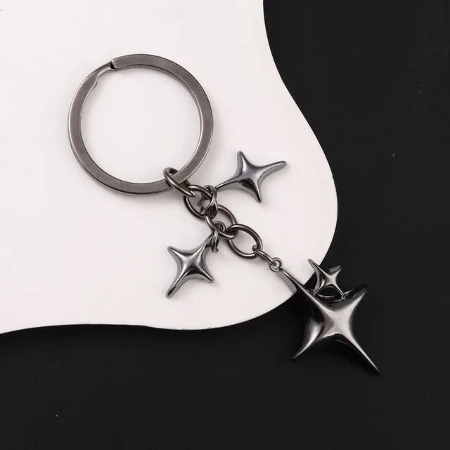 Llave de aleación con forma de estrella y luna de moda creativa