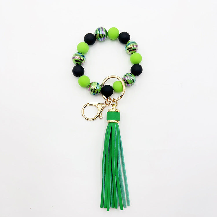 Pulsera de cuentas hecha a mano con borlas y llavero