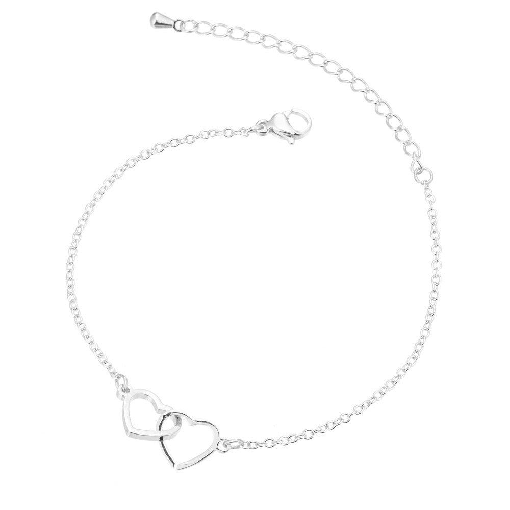 Pulsera moderna con doble corazón en plata de ley S925