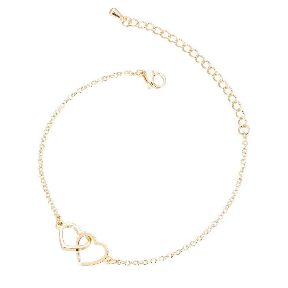 Pulsera moderna con doble corazón en plata de ley S925