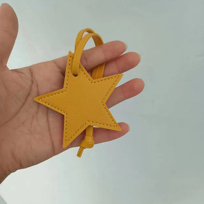 Llavero de cuero con forma de estrella de cinco puntas, colgante para bolso