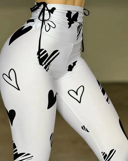 Leggings deportivos de yoga, hip-hop y fitness con estampado de corazones y cordón ajustable