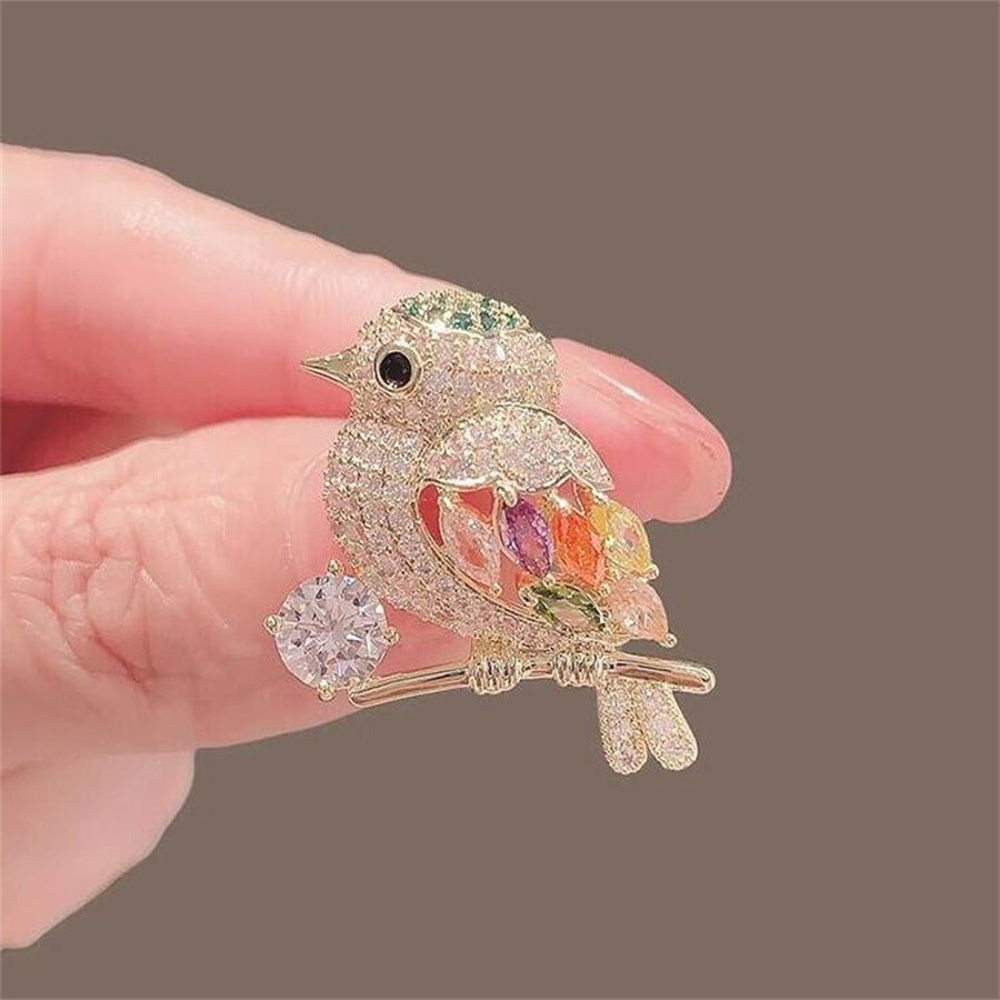 Broche de pájaro urraca con diamantes