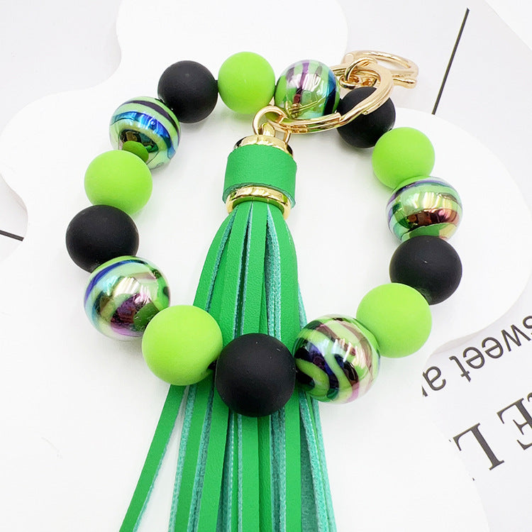 Pulsera de cuentas hecha a mano con borlas y llavero