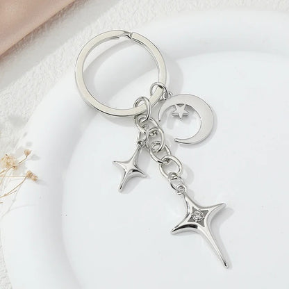 Llave de aleación con forma de estrella y luna de moda creativa