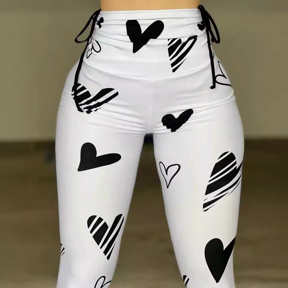 Leggings deportivos de yoga, hip-hop y fitness con estampado de corazones y cordón ajustable