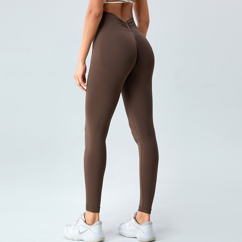 Pantalones de fitness para correr al aire libre para mujer, mallas deportivas sin costuras con realce de cadera en color melocotón