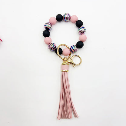 Pulsera de cuentas hecha a mano con borlas y llavero