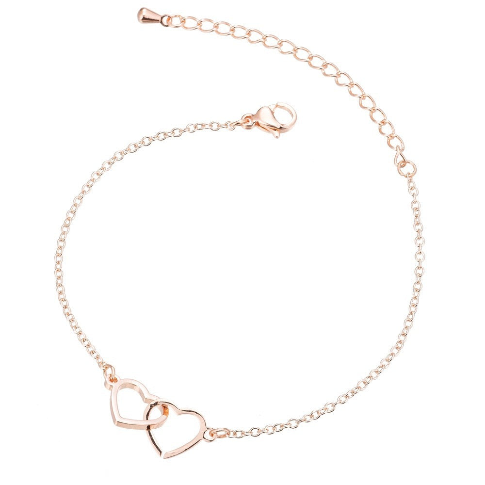 Pulsera moderna con doble corazón en plata de ley S925